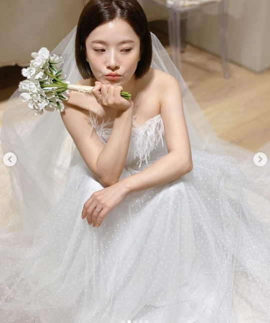 Singer Ben has unveiled a behind-the-scenes cut that was wearing a marriage-style Wedding Dress for Chuseok.Ben posted several photos on his personal Instagram account on September 22.Ben in the open photo is wearing a white Wedding dress of various designs.It is like an angel who smiles brightly at the camera, whether he saw Lee Wook, who was a prospective groom at the time, with the camera.The netizens who watched this cheered such as Where is the wing, It is so beautiful and It is like a fairy.Ben made a marriage ceremony in June after reporting marriage with W Foundation Chairman Lee Wook in 2020.On the other hand, Ben made his debut as a member of the group Bebe Mignon in 2010, and was loved by songs such as devoted and 180 degrees.