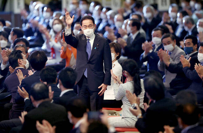 Fumio Kishida stands and waves to the crowd after being elected president of Japan’s Liberal Democratic Party on Wednesday. (AFP/Yonhap News)