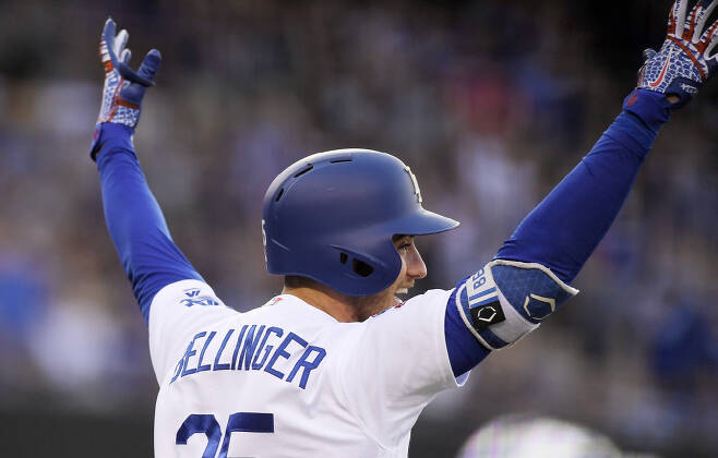 Los Angeles Dodgers' Cody Bellinger celebrates after hitting a grand slam during the third inning of the team's baseball game against the Milwaukee Brewers on Thursday, Aug. 2, 2018, in Los Angeles. (AP Photo/Mark J. Terrill)
