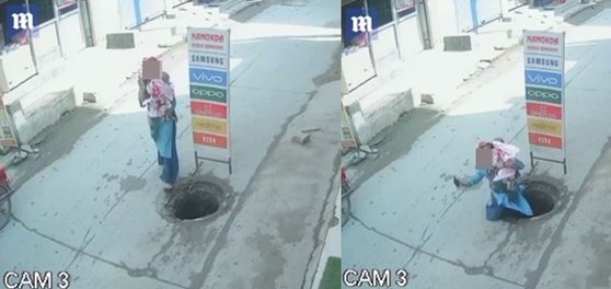 인도에서 아기를 안고 통화하며 걷다가 맨홀 아래로 빠진 여성. [영국 데일리메일 캡처]
