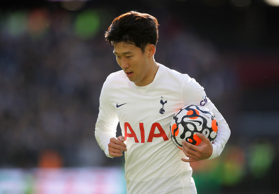 Tottenham Hotspur's Son Heung-min runs with the ball during a game against West Ham at London Stadium in London on Sunday. [REUTERS/YONHAP]