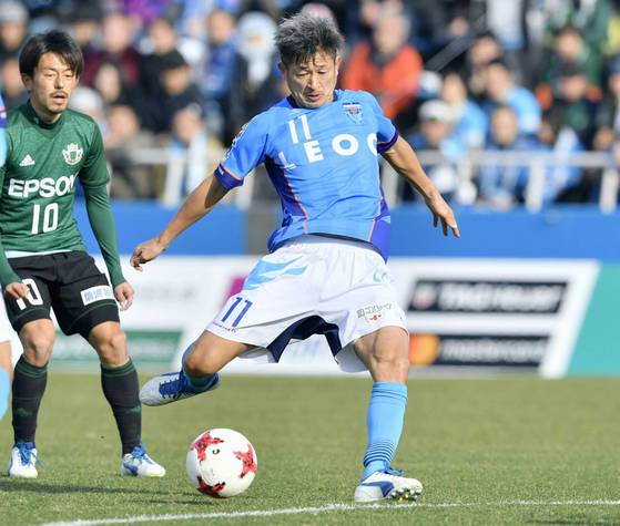 In this Feb. 26, 2017 photo, Kazuyoshi Miura (11) scores a goal during a J-League soccer match against Matsumoto Yamaga, in Yokohama, near Tokyo. One of the longest careers in soccer has been extended after 50-year-old striker Miura renewed his contract with second-division J-League club Yokohama FC on Thursday, Jan. 11, 2018. Miura, who will turn 51 on Feb. 26, will enter his 33rd season this year. Miura played in 12 league games last year and scored one goal, breaking his own record as the J-League's oldest scorer. (Yohei Fukai/Kyodo News via AP)  〈저작권자(c) 연합뉴스, 무단 전재-재배포 금지〉