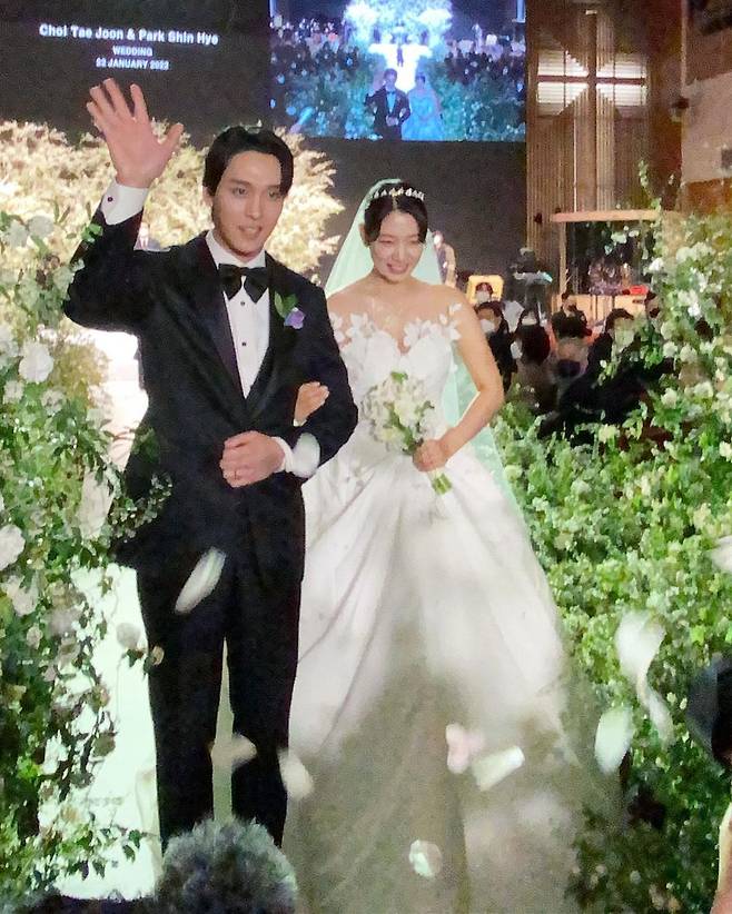 Actors Park Shin-hye and Choi Tae-joon have signed for about a hundred years.Park Shin-hye and Choi Tae-joon held a marriage ceremony at a church in Gangdong-gu, Seoul on the 22nd in the blessing of family members and acquaintances.Son Seon-jae, Bae Jeong-nam, Kim Woo-ri, and Oh Sang-jin, who attended the marriage ceremony as guests, released photos and videos of marriage-style scenes through SNS.The beautiful bride Park Shin-hye in a tube top wedding dress with a shoulder revealed and Choi Tae-joon in a black tuxedo boasted a warm visual.Park Shin-hye, in particular, showed tears while reading the vows of marriage, so Choi Tae-joon wiped away tears while looking lovingly at Park Shin-hye.The marriage celebration was staged by two best friends; FT Island Lee Hong-gi sang the OST Maliya of the drama The Heirs.Crush and EXO D.O. played the drama Dokkaebi OST Beautiful, and the transfer played the piano directly and called Good luck.In addition, Choi Tae-joons best friend Zico was reported to have read a letter for the two.Park Shin-hye and Choi Tae-joon could not hide their happy smiles as they looked at each other with their falling eyes whenever they met their eyes.They also shared a romantic kiss in the blessing of the guests.Choi Tae-joon also showed a caring side, hugging Park Shin-hye right after kissing.Park Shin-hye and Choi Tae-joon, alumni of Chung-Ang Universitys Department of Drama, have been dating since the end of 2017 and have acknowledged and openly devoted to devotion in March 2018.After that, he announced the pregnancy of premarital pregnancy with the announcement of surprise marriage last November.Park Shin-hye expressed his affection for Choi Tae-joon, saying, It has been my support for a long time and has covered even the lack of human Park Shin-hye.Choi Tae-joon expressed his affection for Park Shin-hye, saying, It is a person who reminds me how to laugh brightly when I am happy, and how to cry out loud when I am sad.