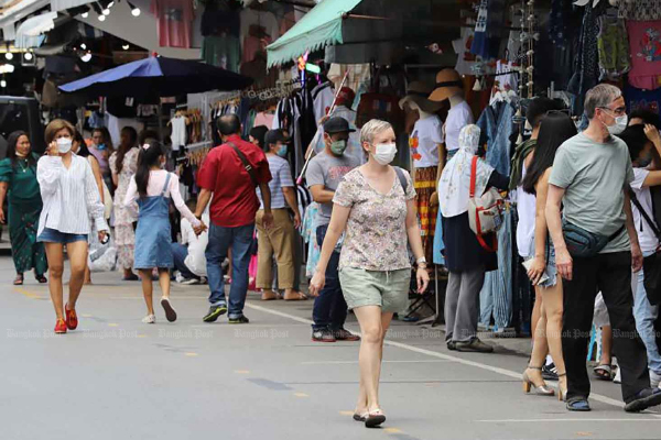 More people visit the Chatuchak weekend market in Bangkok on Sunday as the Covid-19 situation improved. (Photo: Apichit Jinakul)