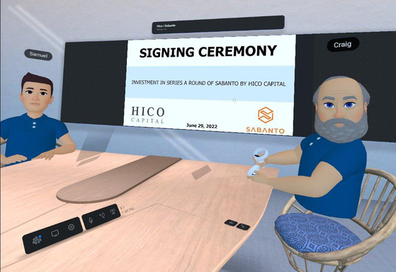 Avatars of Samuel Kim, managing director of Hico Capital, left, and Craig Rupp, Sabanto CEO, pose for a photo during an online signing ceremony held in a virtual space on Meta. SK networks' U.S. investment firm Hico Captial is investing $4 million in Sabanto. [SK NETWORKS]