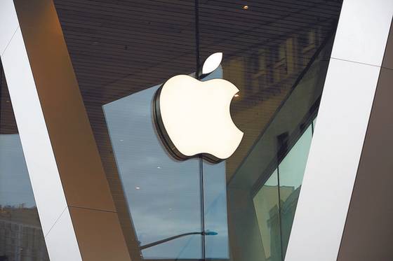 An Apple logo on the facade of the downtown Brooklyn Apple store in New York [AP]