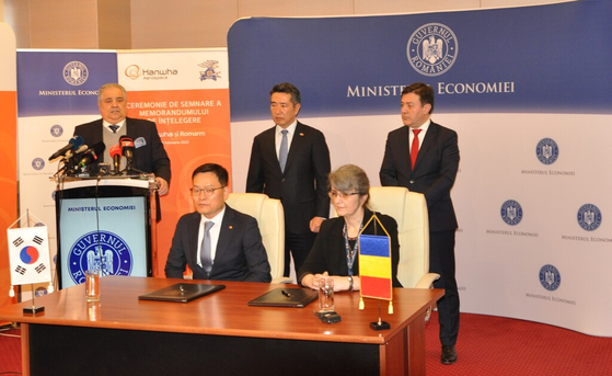 Hanwha Aerospace CEO Son Jae-il, left in the first row, and Florentina Micu, Romarm's director, at a signing ceremony of a memorandum of understanding in Romania on Feb. 6. [HANWHA AEROSPACE]