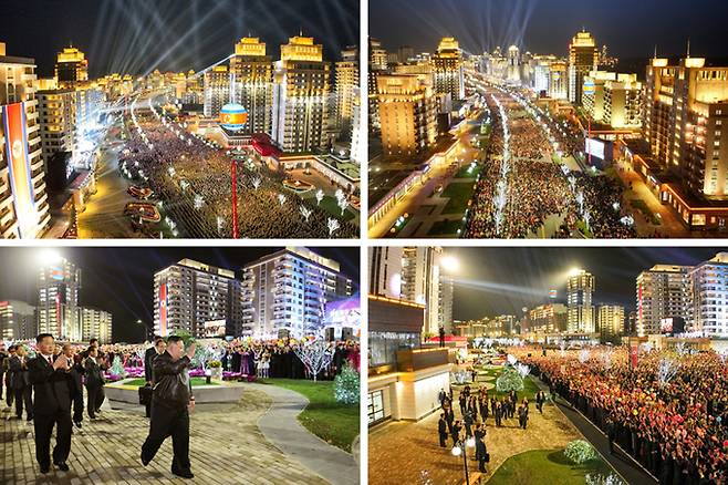 지난 16일 김정은 총비서가 화성지구 2단계 1만 세대 살림집(주택) 준공식에 참석했다. 김 총비서는 준공테이프를 끊고 새 살림집을 받은 근로자들을 축복해줬다고 한다. 평양=노동신문·뉴스1