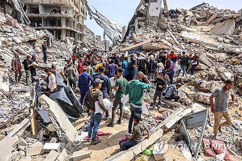 가자지구 북부에서 이스라엘과 하마스 교전으로 파괴된 건물 [AFP 연합뉴스 자료사진. 재판매 및 DB 금지]