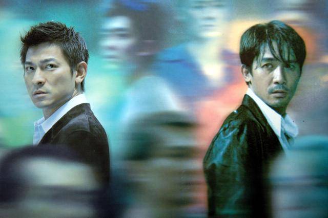 유위강 감독의 영화 '무간도'(2002년) 주연을 맡은 유덕화와 양조위. 한국일보 사료사진