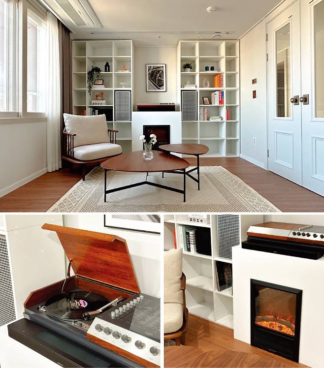 침대 반대편에 응접실 스타일로 연출한 공간. 벽면 가득 책장을 설치해 스피커와 LP 플레이어, 사운드바 등을 보기 좋게 배치했다.