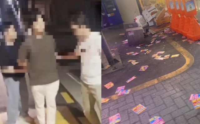 경찰이 서울 강남 일대에서 불법 전단을 살포한 범인을 체포하고 있다. 사진 제공=서울경찰청