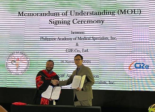 (우)윤용광 지투이 이사와 PAMS 관계자가 기념촬영을 하고 있다.(사진=지투이 제공) *재판매 및 DB 금지