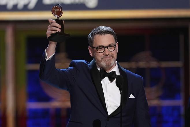 Michael Arden accepts the award for best direction of a musical for "Maybe Happy Ending" during the 78th Tony Awards on Sunday at Radio City Music Hall in New York. (AP-Yonhap)