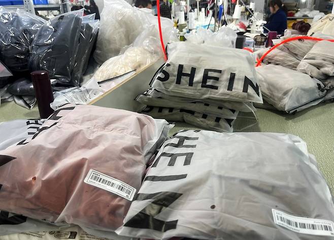 Shein apparel is prepared for shipment at a manufacturing site in Guangdong Province, China, last month. (Reuters-Yonhap)
