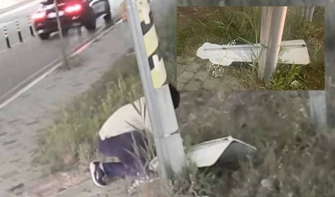 쭈그려 앉아 등신대를 파손하는 A씨의 모습. /사진=유튜브 '이윤희 실종사건 공식채널' 영상 캡처