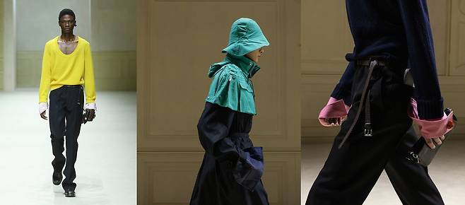 프라다는 원색으로 룩에 포인트를 줬다. 옐로 컬러 니트와 트렌치코트 위의 청록색 케이프, 분홍색 셔츠는 강렬한 인상을 자아냈다. 사진 프라다