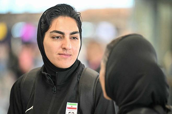 Iranian women's football team captain Zahra Ghanbari looks on as she arrives with other members of her team at the Kuala Lumpur International Airport in Sepang on March 16, 2026, after staying in a hotel in the Malaysian capital while awaiting the next leg of their journey home. Three more members of the Iranian women's football team have left their asylum in Australia and decided to return home, Canberra said on March 15. (Photo by MOHD RASFAN / AFP)
<저작권자(c) 연합뉴스, 무단 전재-재배포, AI 학습 및 활용 금지>