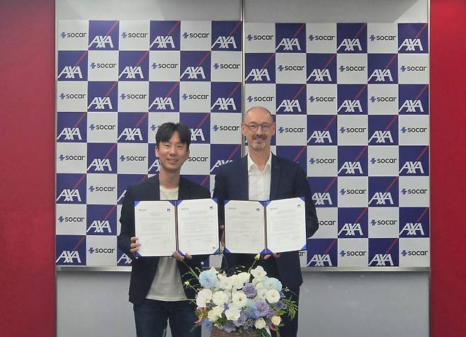 박재욱 쏘카 대표와 한스 브랑켄 AXA손해보험 대표. 사진=쏘카